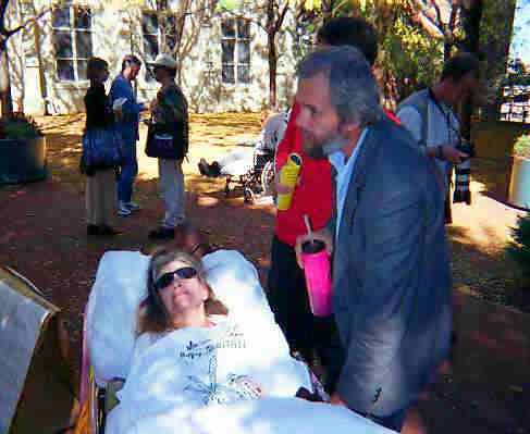 Jim and Cheryl Miller share a moment at the protest